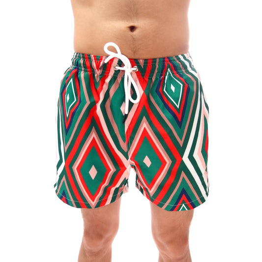 Green and red patterned swim shorts with a white drawstring on a white background