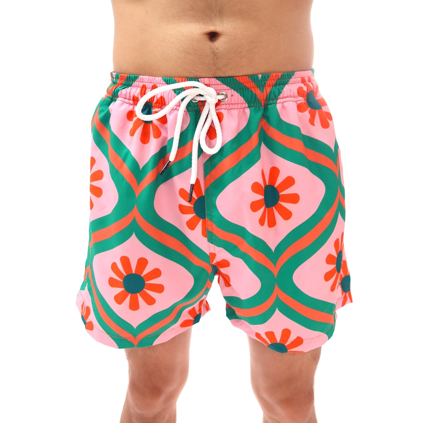 Colorful geometric patterned swim shorts on a white background