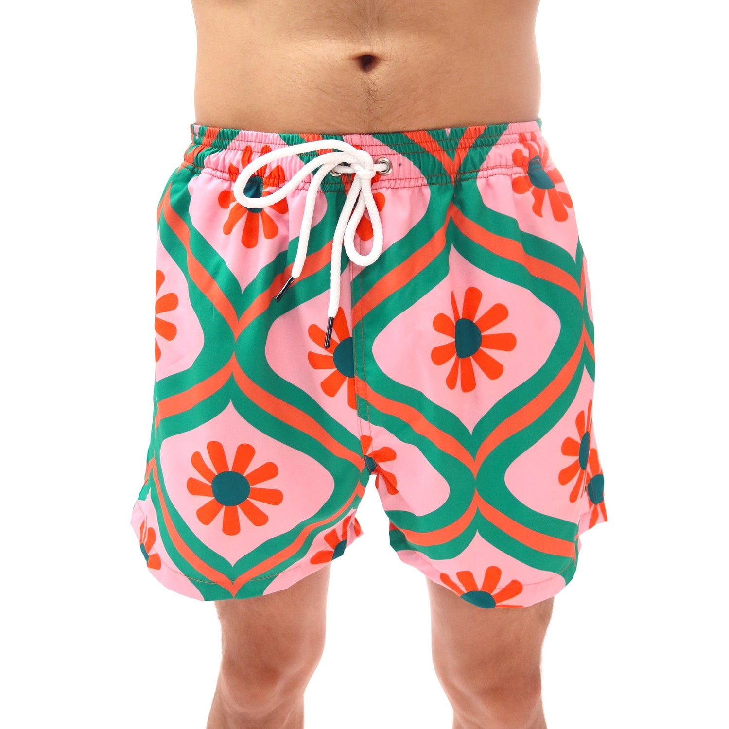 Colorful geometric patterned swim shorts on a white background